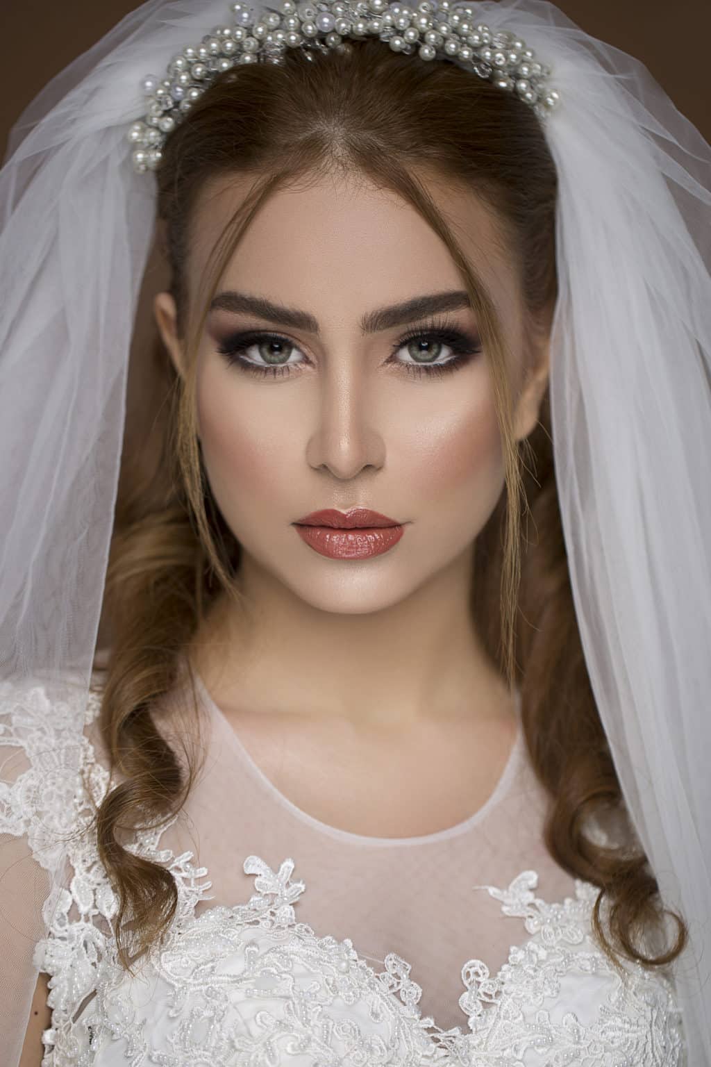 Blond model in wedding dress and bridal makeup